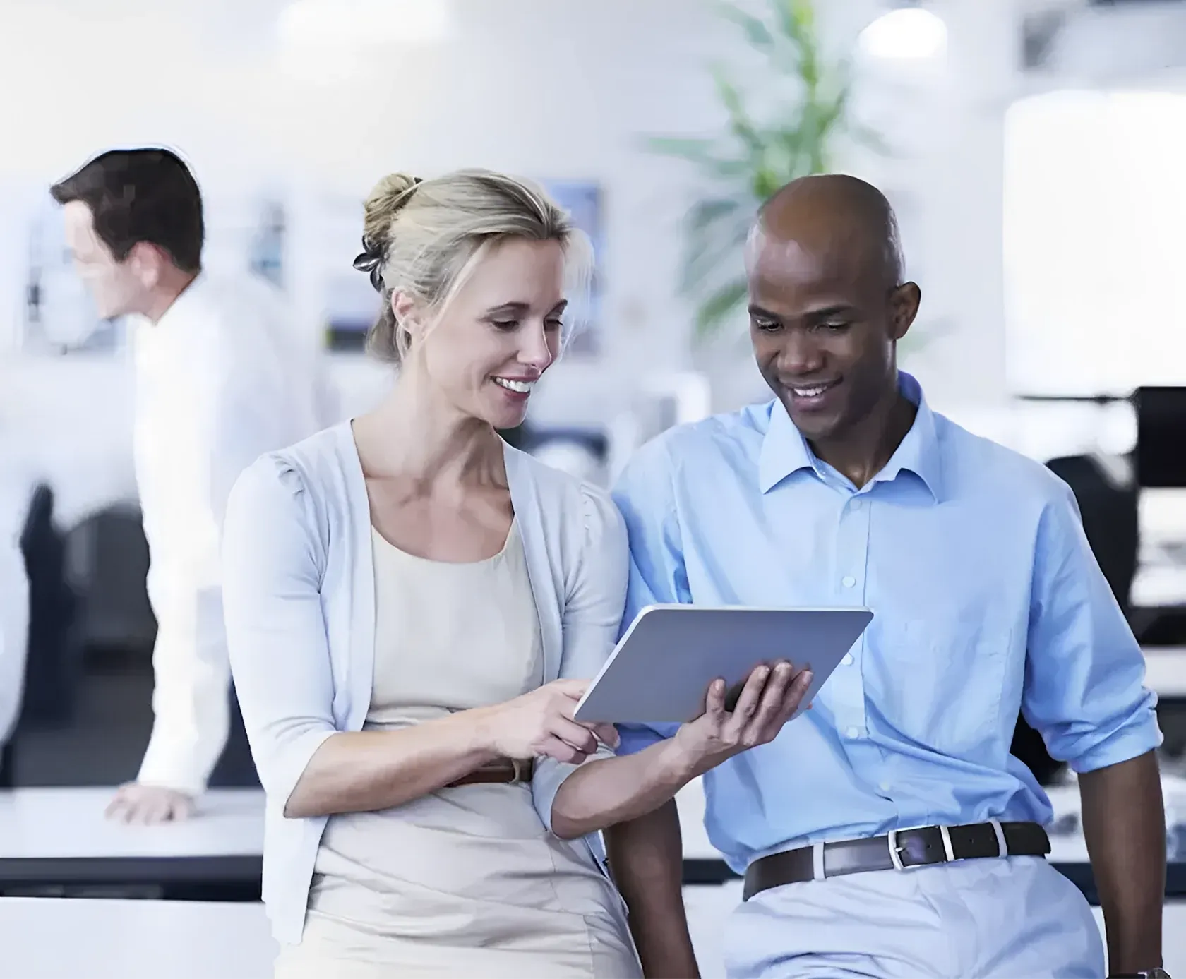 Insurance agent reviewing a commercial trucking policy with a client on a tablet